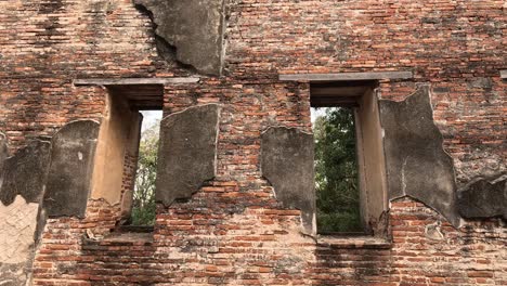 gradual reveal of a buddha statue amidst ancient ruins.