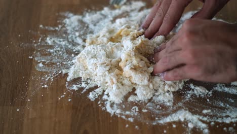 bread-making mastery: senior chef creates bread with flour and kneading - slow-mo closeup