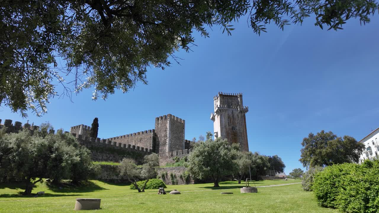 Castle of Beja in Portugal, wide-angle view of medieval architecture and greenery