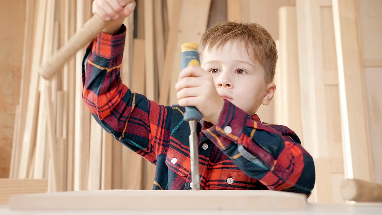 Young Boy Learning to Work with Wood