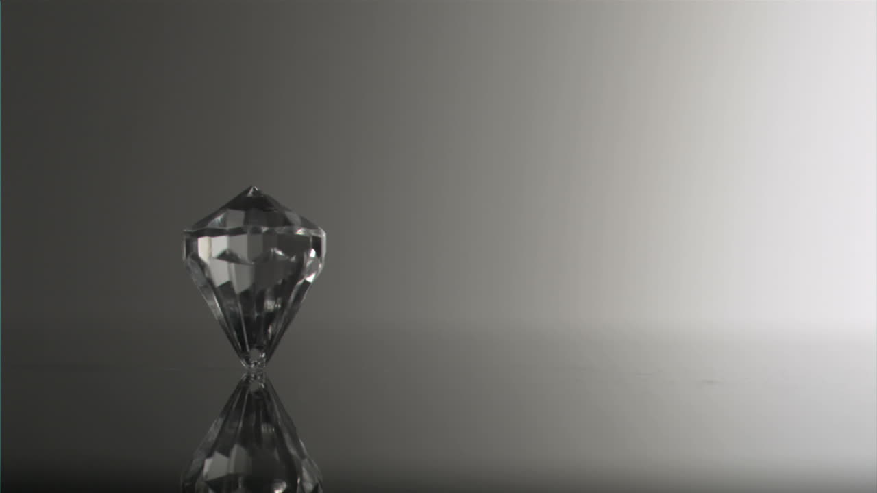 Clear diamond in super slow motion spinning