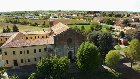 exterior of chiesa santa maria delle grazie church in soncino, italy - drone shot