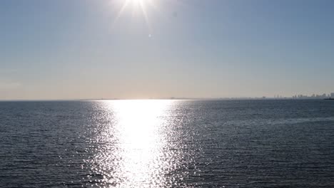 sun reflecting on calm ocean waters