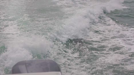 closeup in slow motion of a boat trail wave