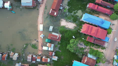 rise above swampland houses in rural cambodia phnom krom