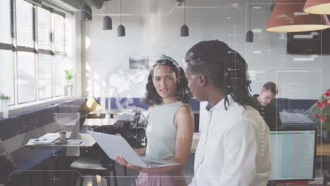 Animation-of-globe-and-hud-interface-over-diverse-coworkers-discussing-reports-over-laptop-in-office