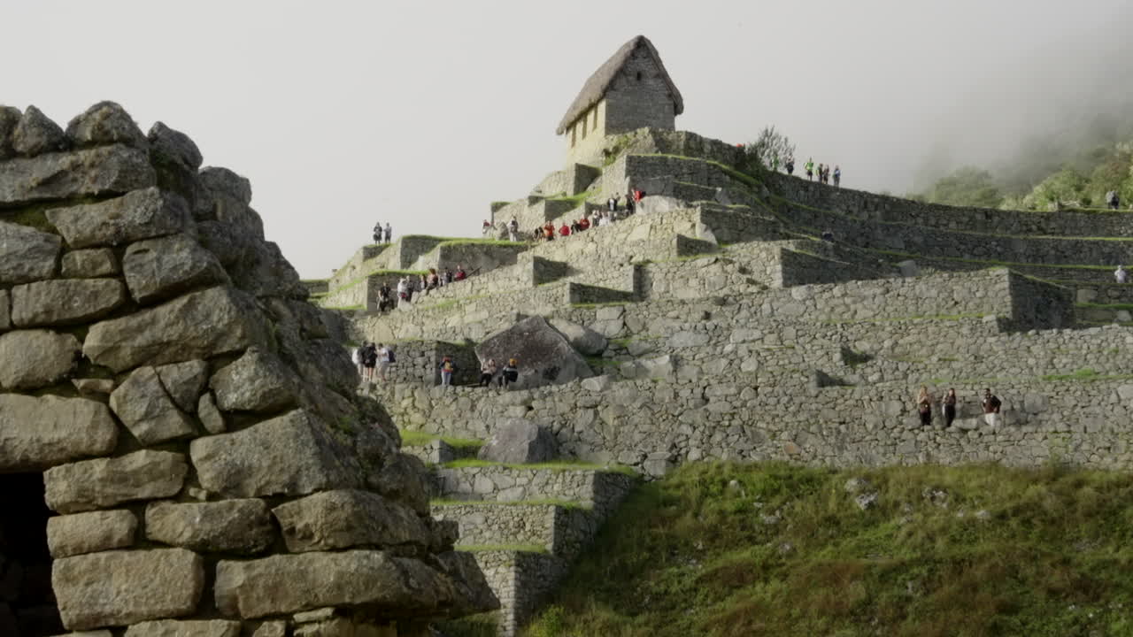 Zoom out of Machu Picchu walls structure. Ancient Inca archaeological stone citadel. Modern World Wonder