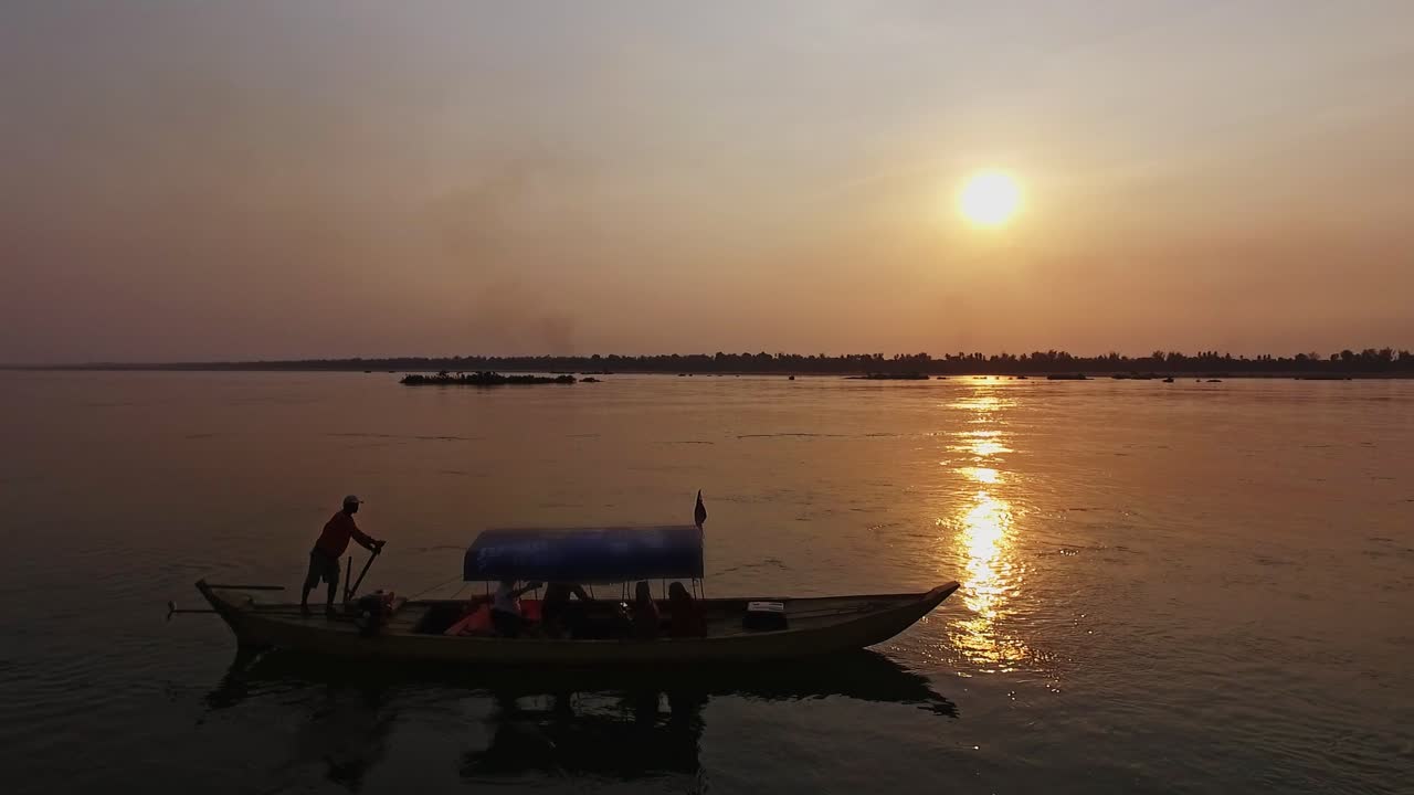 Mekong River, Asia - The Beautiful Scenery Of A Boat Floating By The River During Sunset - Aerial Shot