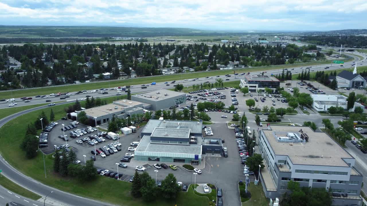 Busy Glenmore Trail Traffic with Tsuu T'ina Nation 145 Land in the Background. Calgary, Alberta