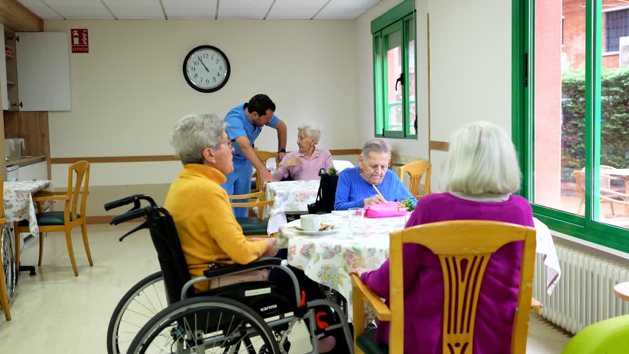 Elderly residents being cared for in a nursing home