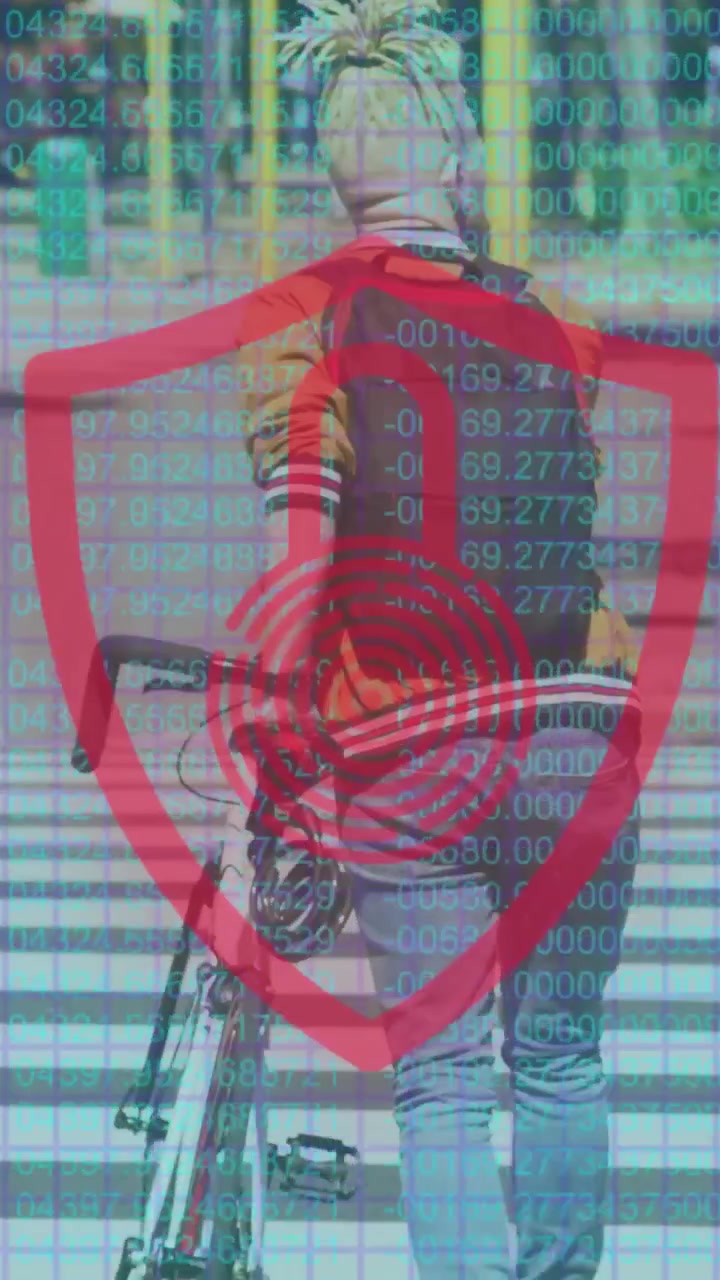 Vertical video: Man pushing bike across crosswalk, shield appearing and tracking for transport tech