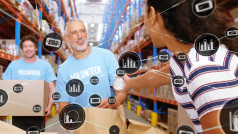 animation of network of connections with icons over diverse volunteers working in warehouse