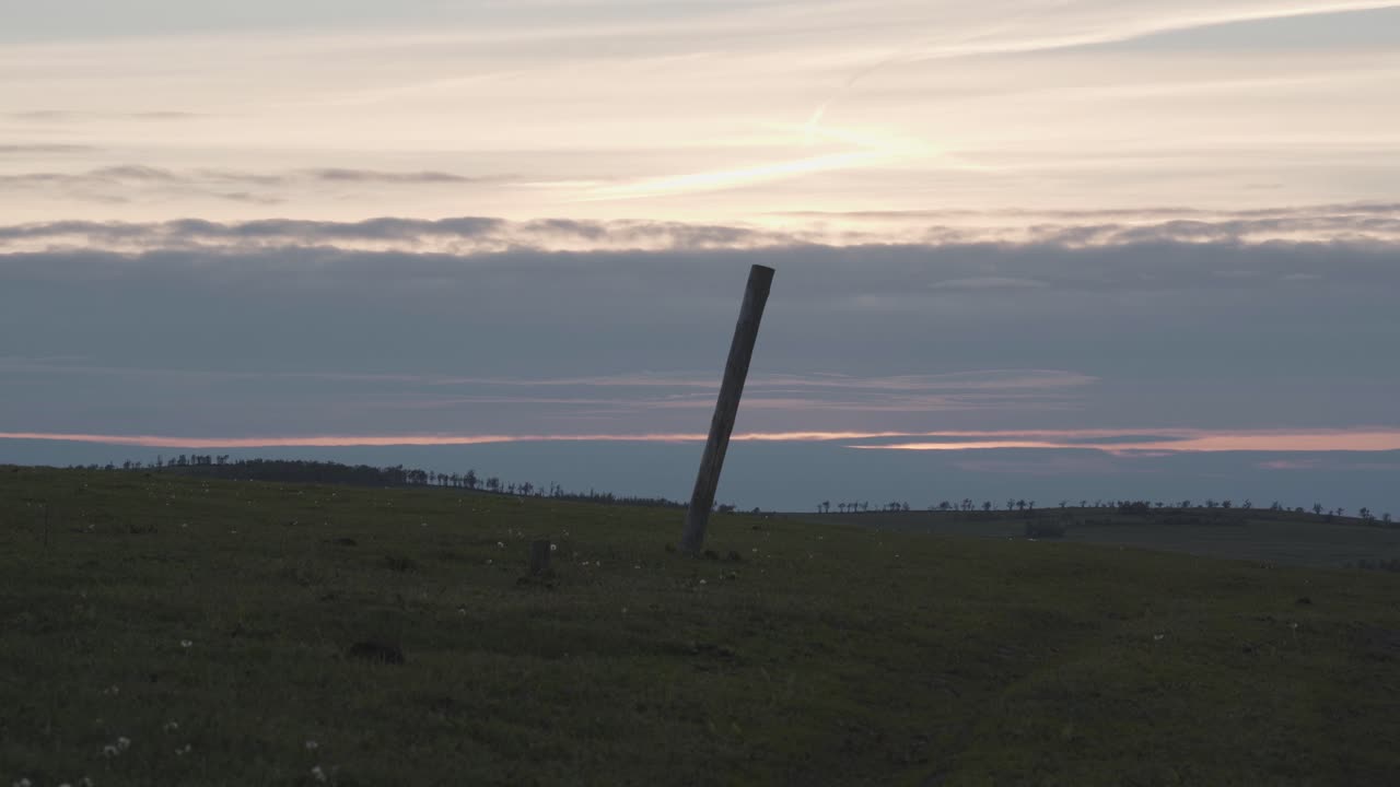 Timelapse of the sunset on the countryside. Clouds are running and sun is setting down. On the detail heat waves are visible.