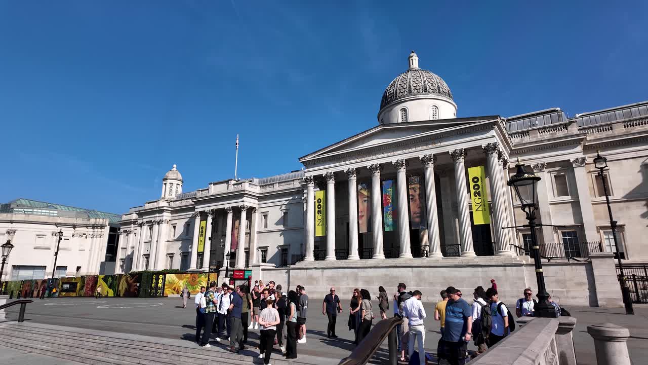 The National Gallery in London with people gathered outside
