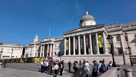 the national gallery in london with people gathered outside