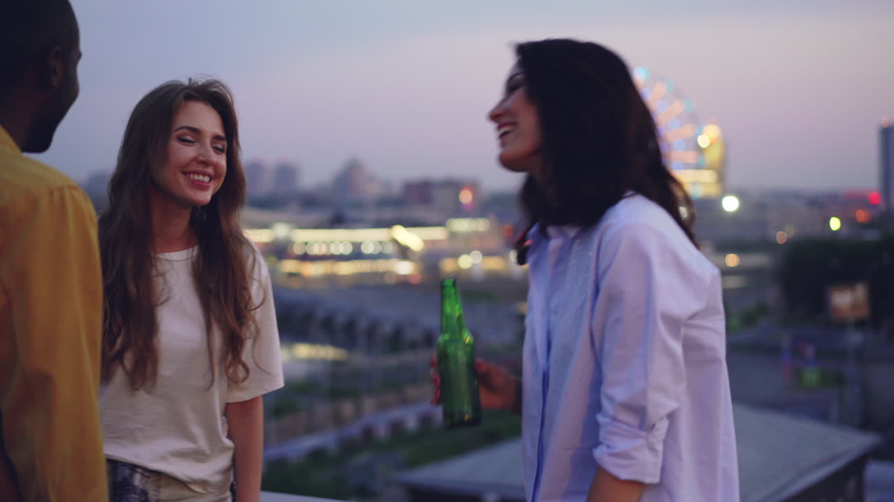 Friends enjoying a rooftop evening with a view
