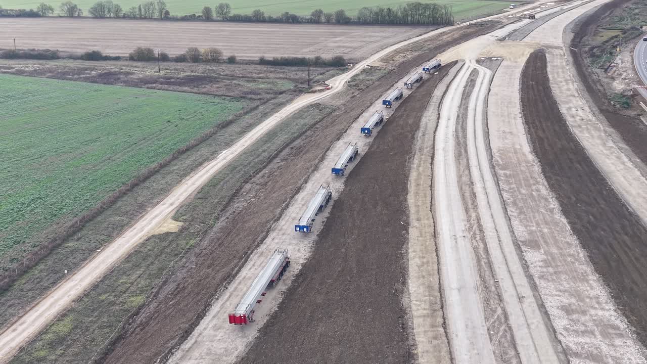 Construction parts lined up A428 highway road upgrade Cambridgeshire UK Aerial