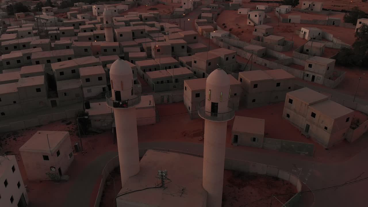 aerial view orbiting two beatiful old mosques at palestine empty city in the morning.