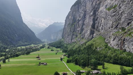 alpine valley steep cliff face lauterbrunnen valley switzerland drone,aerial