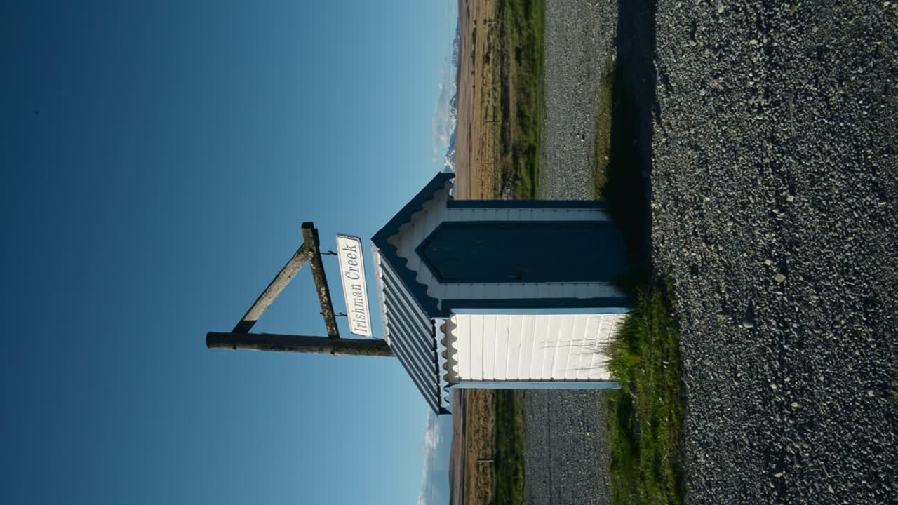 Irishman Creek Station, birthplace of the Hamilton Jet in golden sunshine with mountains in background