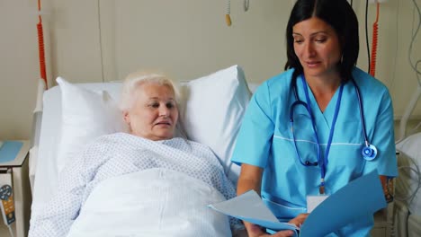 female doctor discussing report with senior patient