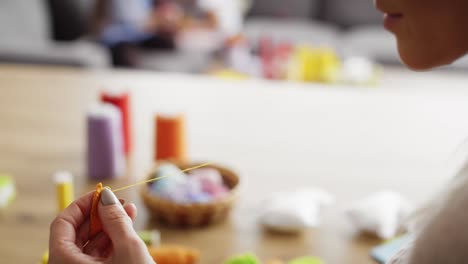 Detail-video-of-woman-sews-at-the-table