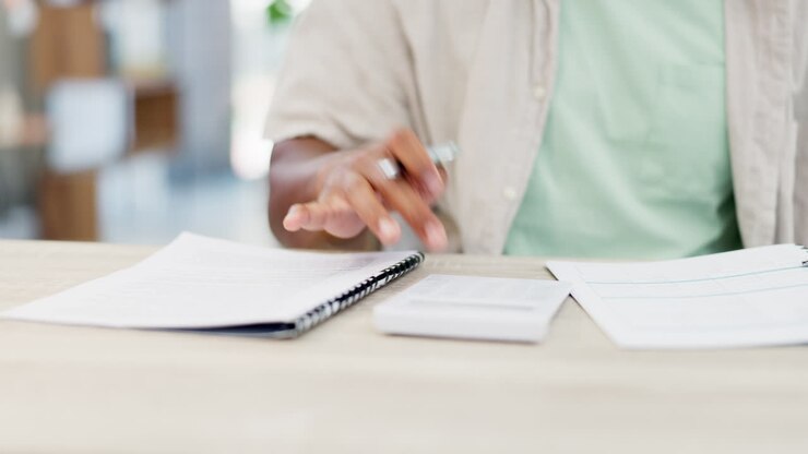 Budget, paperwork and calculator with man hands