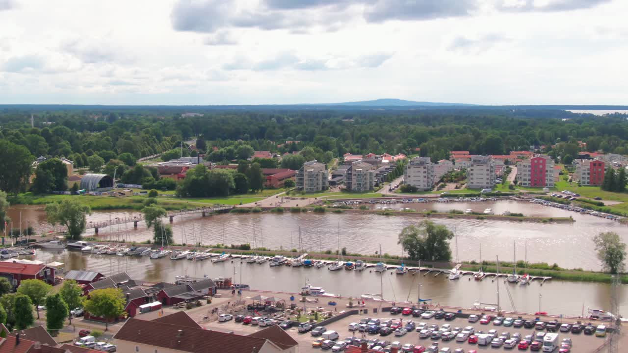 View over the marina, new apartments, and the Tidan River flowing into Lake Vänern