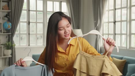 young girl fashion blogger or woman showing casual colorful shirts on camera for sell online