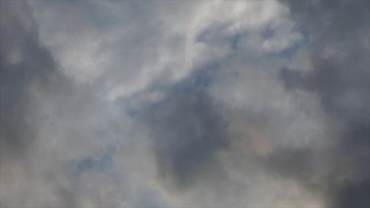 dark clouds moving in the blue sky with a thunderstorm