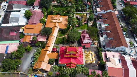 vibrant colours around a burmese temple in the city of penang