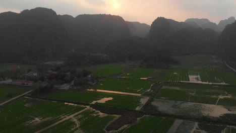 famous ninh binh tamcoc vietnam rice fields during sunrise, aerial