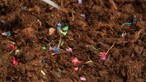 plastic confetti in soil