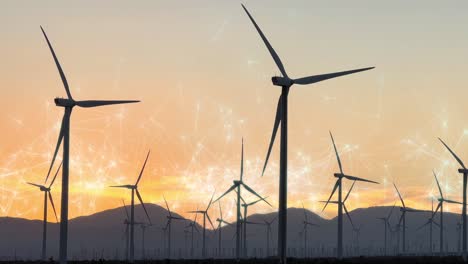 Wind-Turbines-with-VFX-overlay-graphics-at-sunset,-renewable-energy-concept-static-shot