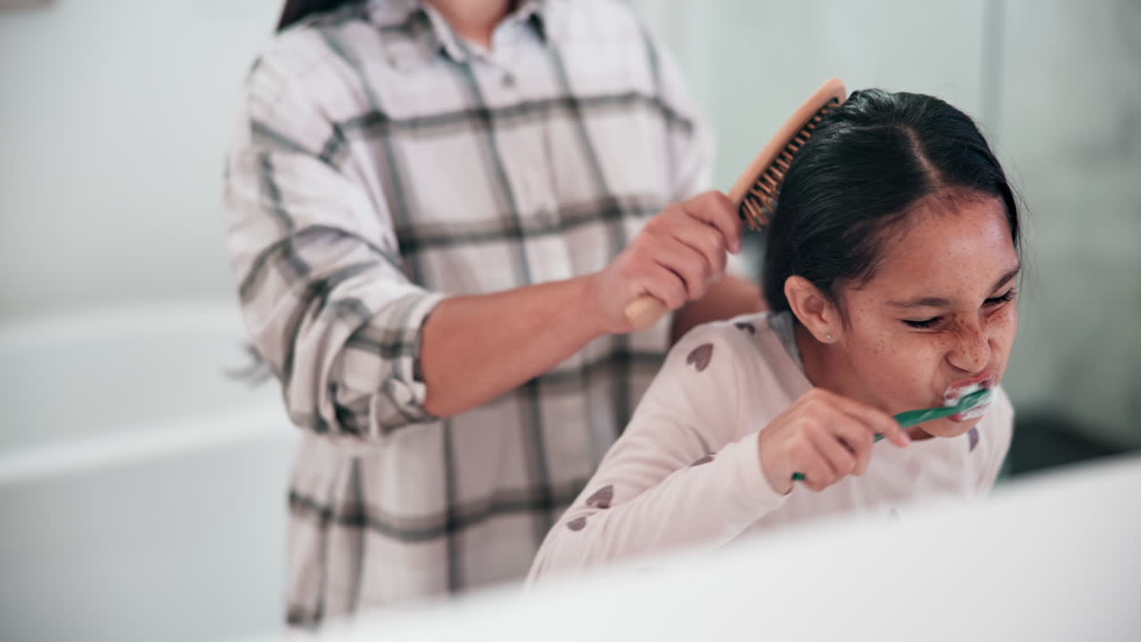 Mom, girl child and brushing teeth in bathroom