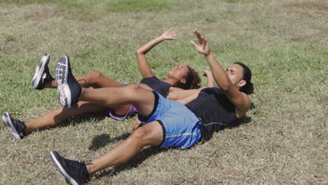 couple exercising with legs up