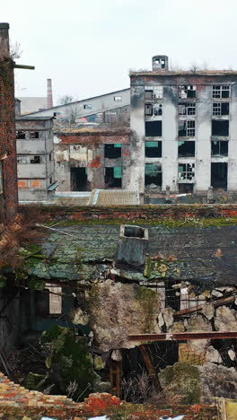 abandoned industrial building. ruins of an old factory. aerial view vertical video