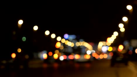 defocused lights los angeles street abstract. city blur background. moving bokeh circles of night traffic.