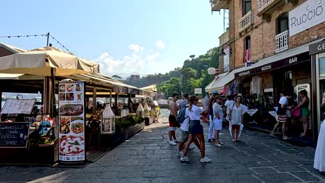 people walking near shops and cafes