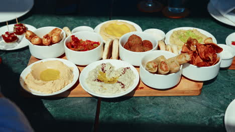 group of friends sharing and tasting traditional moroccan food.