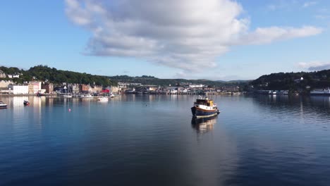 Fishing-Boat-on-Oban-Harbour-Lake,-Seaside-Town-on-West-Coast-of-Scotland,-Aerial-Drone-4K-HD-Circling