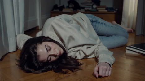 a young woman lying on the floor