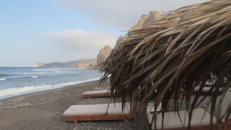 Slider-shot-of-the-black-beach-of-Santorini