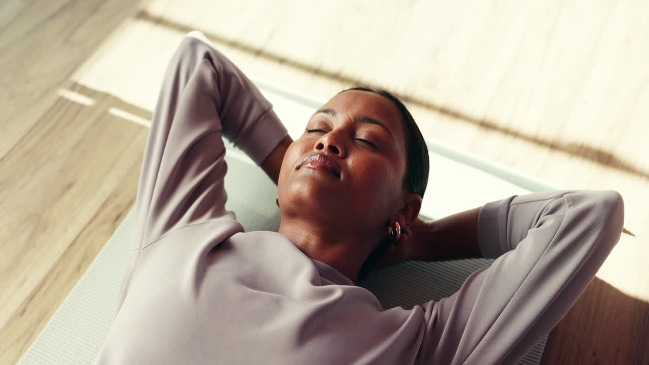 Woman Relaxing on Yoga Mat