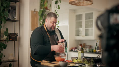 chef demonstrates tomato grating technique