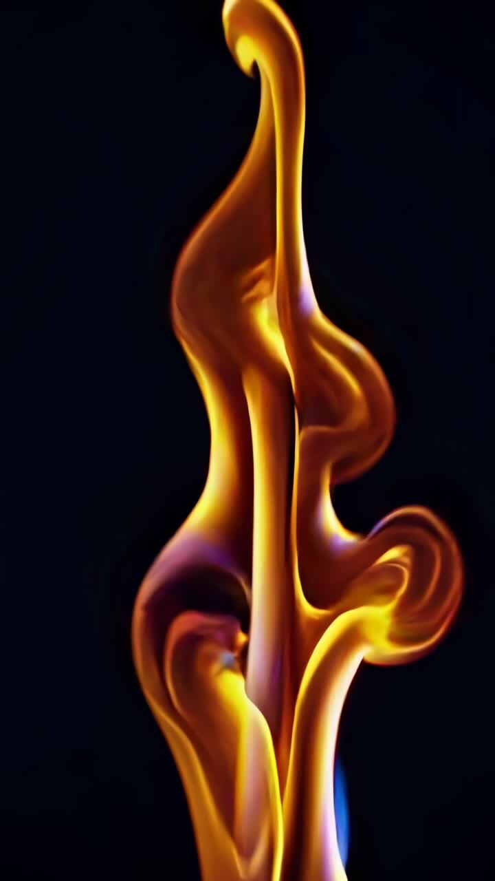 Abstract video of swirling golden flames, captured from a low-angle, showcasing dynamic movement