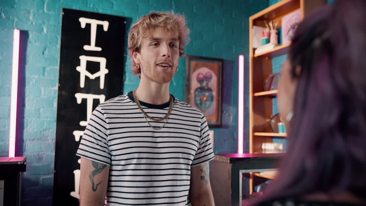 Tattoo Artist and Client in Tattoo Studio