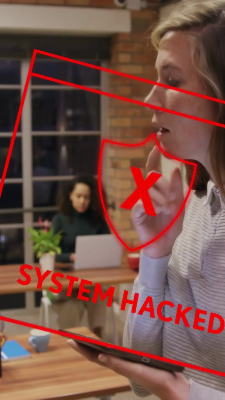 Vertical video: Standing woman tapping device, causing red SYSTEM HACKED overlay, checking security