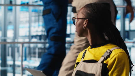 worker using tablet in smart factory, collecting and analyzing data