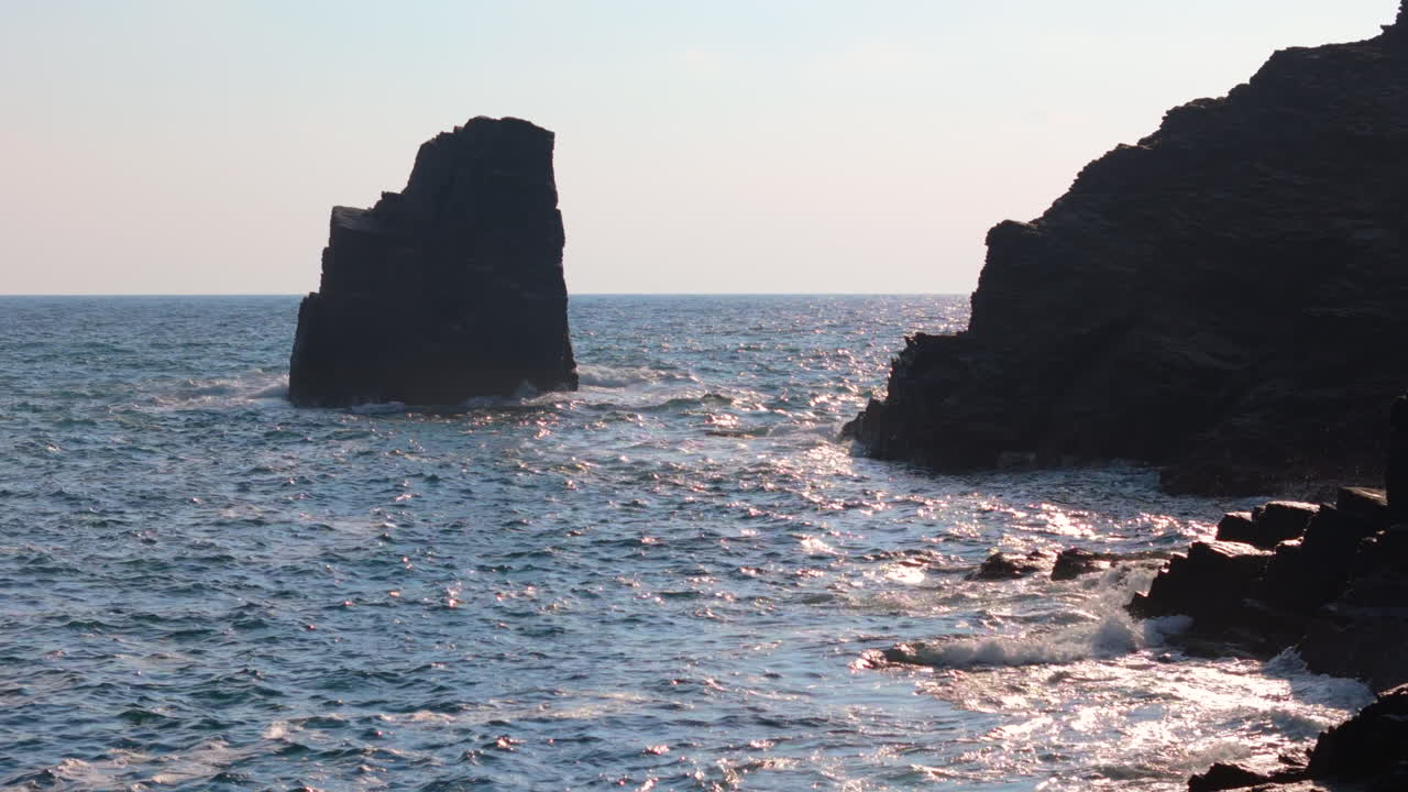 Rugged Coastline with Sea Stack and Crashing Waves